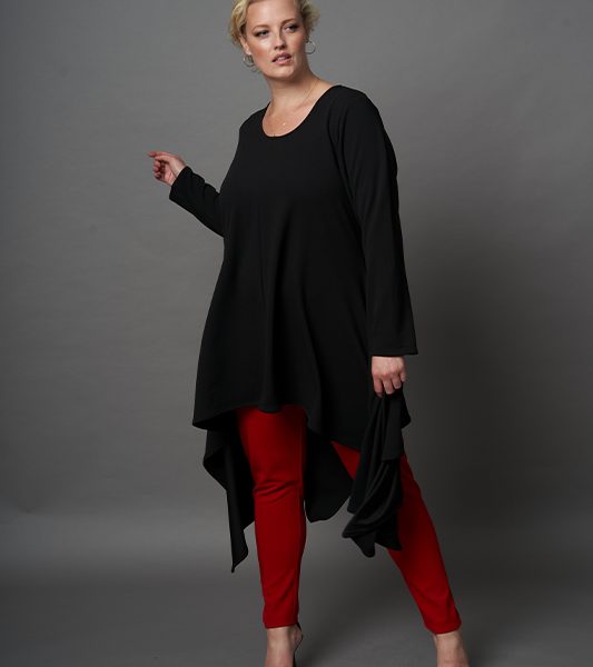 A plus size long Sleeve Handkerchief Hem Dress in black and red made with scuba crepe, and round neckline.
