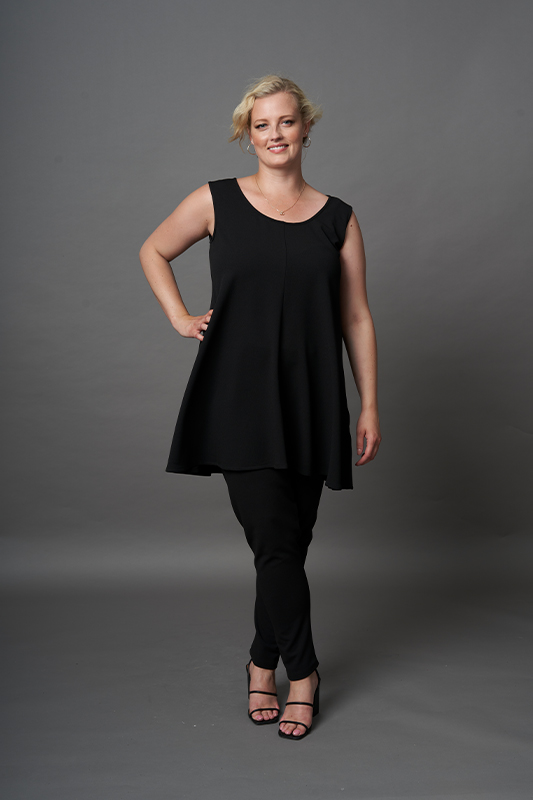 A plus size women's black sleeveless scoop neck top with relaxed swing silhouette